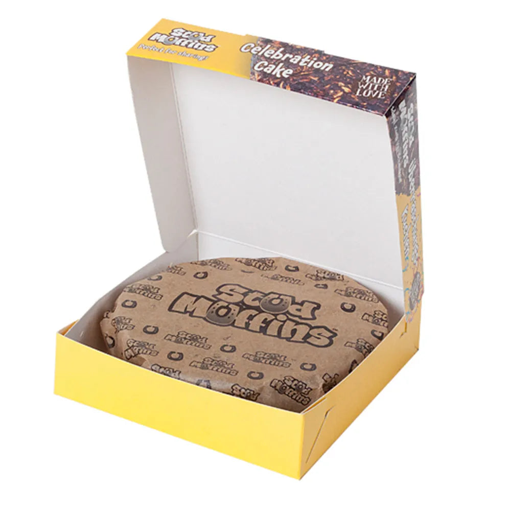 Box of Stud Muffins Celebration Cake for horses with yellow and brown design on a white background