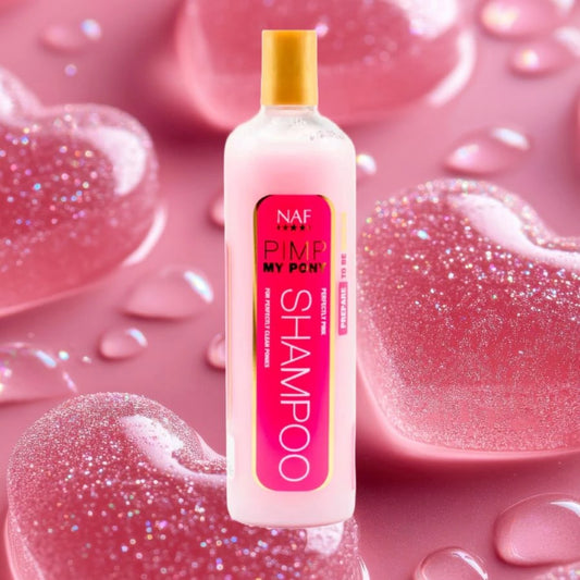 A bottle of NAF Pimp my Pony horse Shampoo on a background of pink sweets/ candy. The colour theme is pink