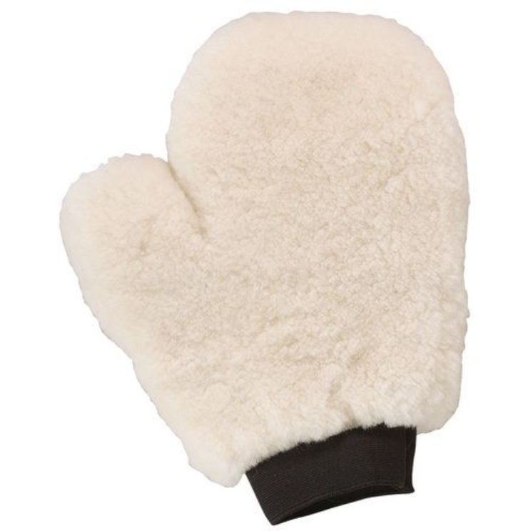 White sheepskin grooming mitt with black cuffs on a white background