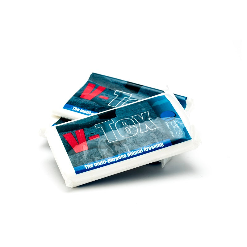 Two V-Tex poultice packets on a white background
