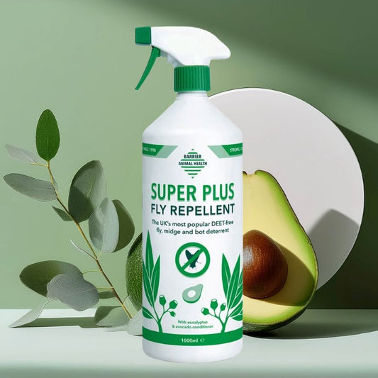 Barrier Super Plus Fly Repellent spray bottle with avocado and leaves on a green background