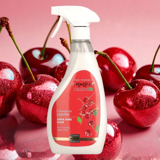 Spray bottle of Champion Cherry Coat Shine for horses with a cherry-themed label surrounded by cherries on a pink background