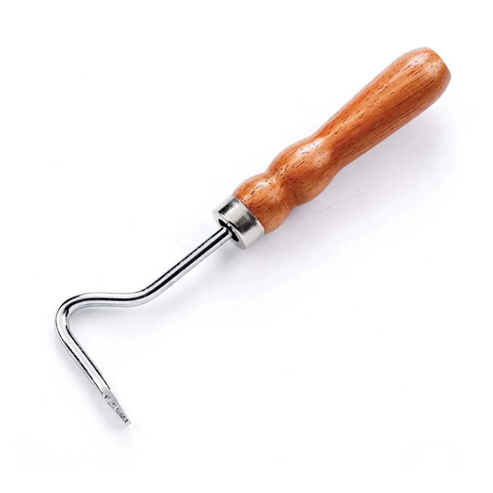 Metal hoof pick for horses with wooden handle on a white background