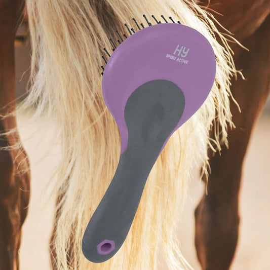 Purple and grey grooming brush being used on a horse's tail.