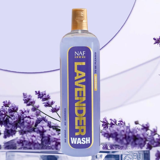 A bottle of NAF Lavender Wash for horses with lavender flowers in the background
