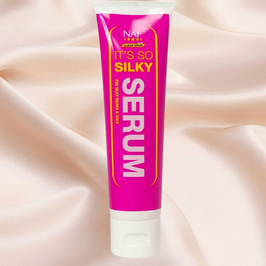 Tube of NAF It's So Silky Serum on a soft pink background