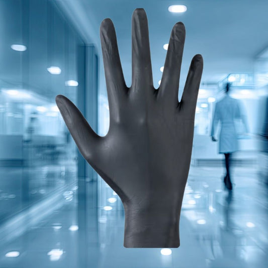 Black nitrile glove in front of a blurred hospital corridor