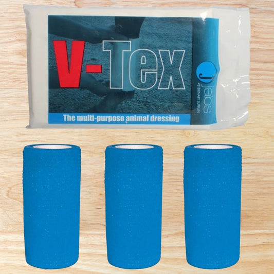 V-Tex multi-purpose animal dressing packaging with three blue cohesive bandages on a wooden surface