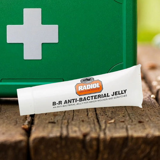 Tube of B-R Anti-Bacterial Jelly for horses with a green first aid box in the background